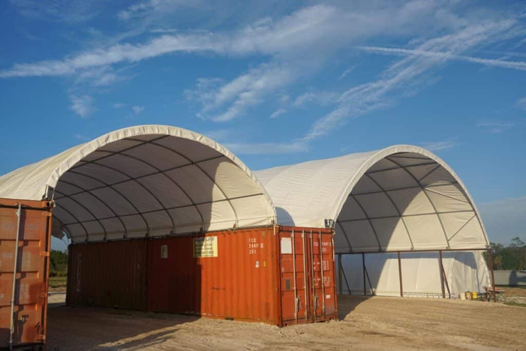 Consecutive storage units optimizing shipping container roofs.